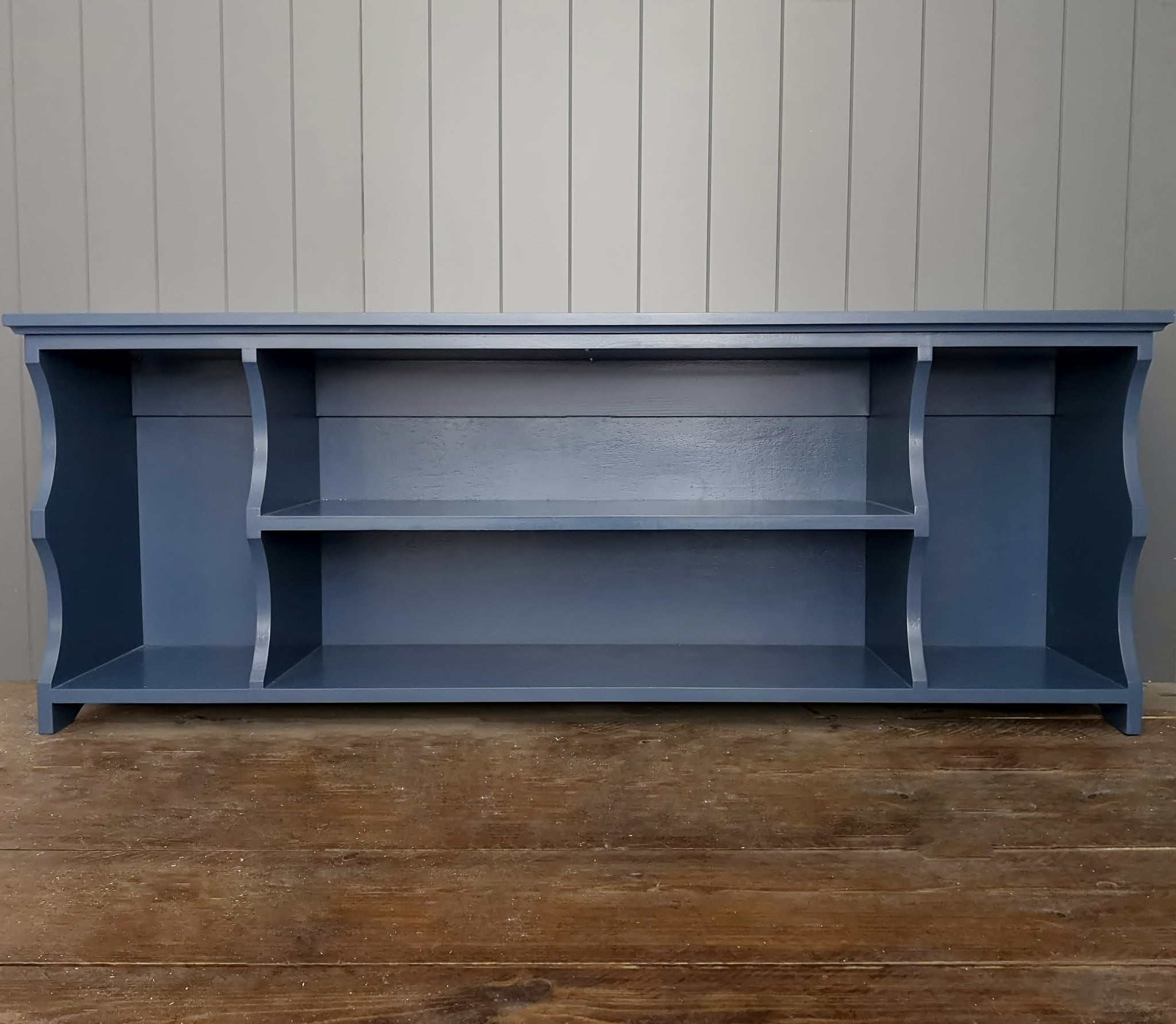 Funky painted hallway bench.  Dark blue boot and shoe storage