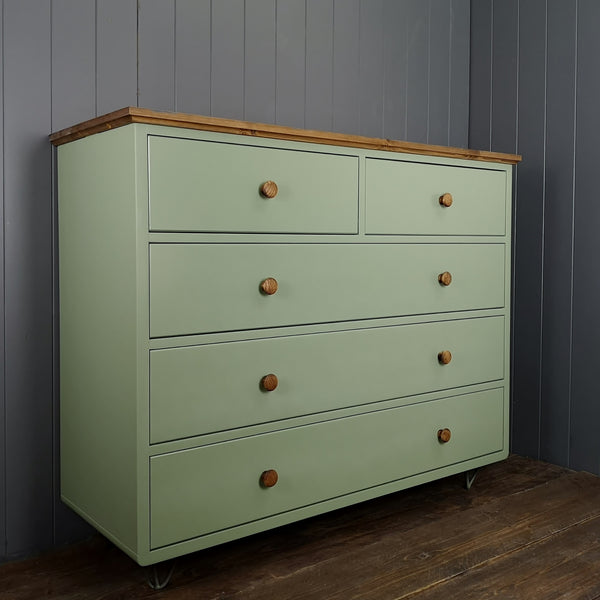 Large chest of drawers painted in a bespoke colour with an antique pine top and haipin feet. Drawers open to show contrast.