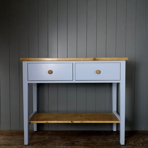 Painted blue and finished in antique pine hallway console table or side board with two deep drawers and a wooden shelf.