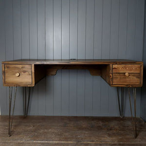 A hand made retro style desk in a dark wood finish. A square drawer at either end and standing on cast iron retro  hairpin legs. Mid century look for a home office.