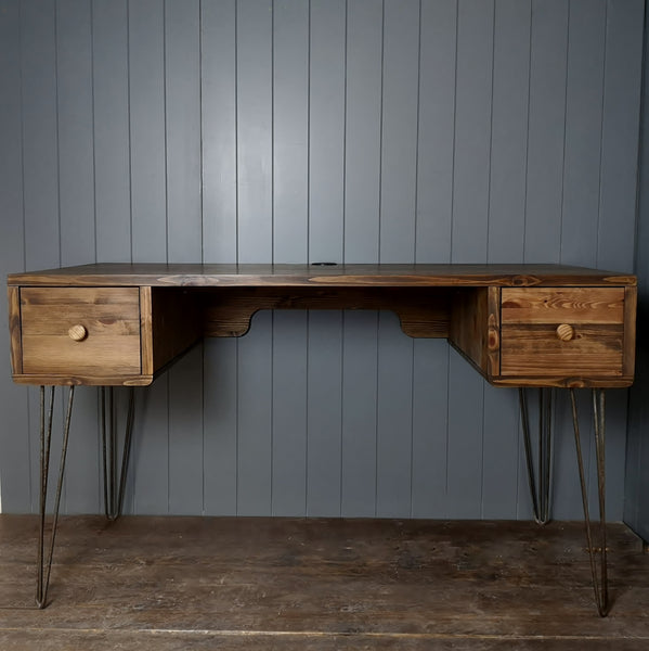 A hand made retro style desk in a dark wood finish. A square drawer at either end and standing on cast iron retro  hairpin legs. Mid century look for a home office.