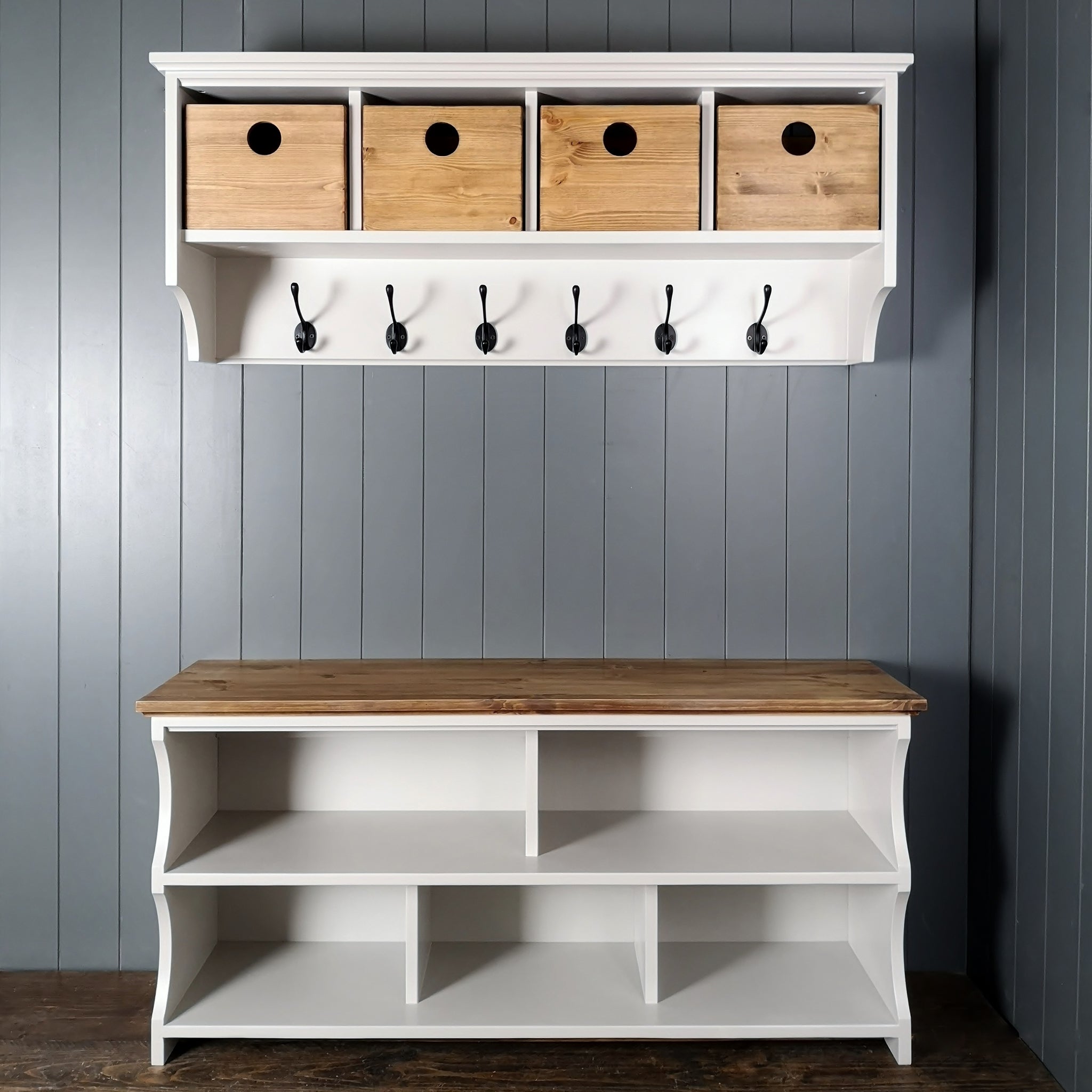 Hallway set comprising of a coat rack with hand made storage boxes and a shoe bench with compartments for shoes and a wooden top to match coat rack boxes suitable for sitting on.