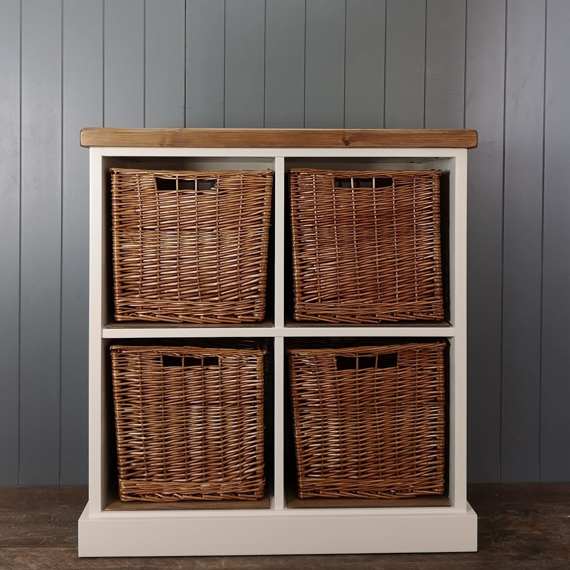 Large antique white painted hallway or nursery storage. 4 large wicker storage baskets suitable for shoes or toys. Antique pine wooden top.