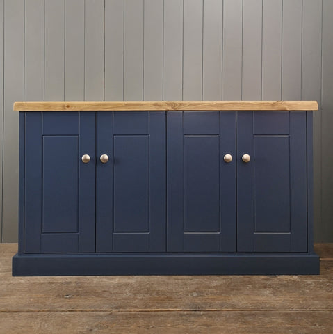Large painted cupboard with brushed satin knobs and a rustic antique pine top.