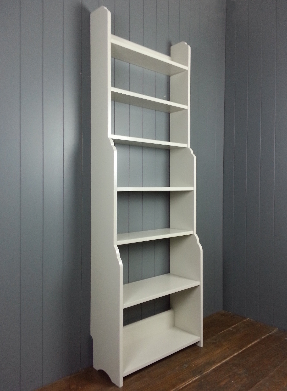 Tall hand made painted book case with cascading shelves