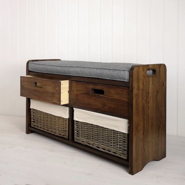 Hallway seat made from solid wood with two baskets and a cushion. Two deep drawers, one open to show contrast of dark wood finish and natural wood finish inside the drawers.
