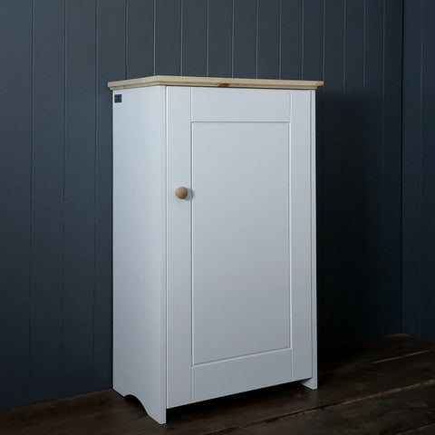 White painted storage cupboard with a blonde pine finshed top and knob