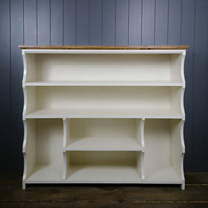 Painted in antique white with an antique pine top. Shoe and boot rack. two long shelves, two small shelves with a space for boots on either side.