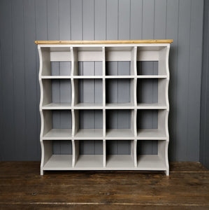 Painted shelving unit with 16 cubbies to store shoes