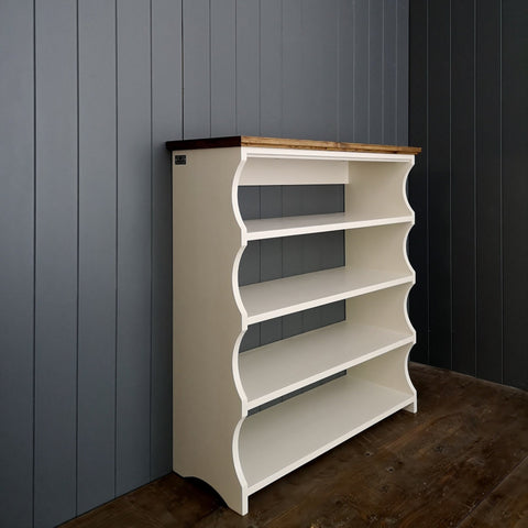 Painted antique white with an antique pine top. Four shelf hallway shoe rack or book case without a back.