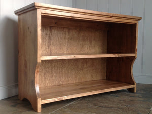 Solid wood shoe bench with two shelves finished in anique pine. Decorative curved cut out to bottom shelf.